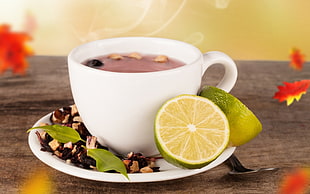 cup of hot chocolate with slices of lime